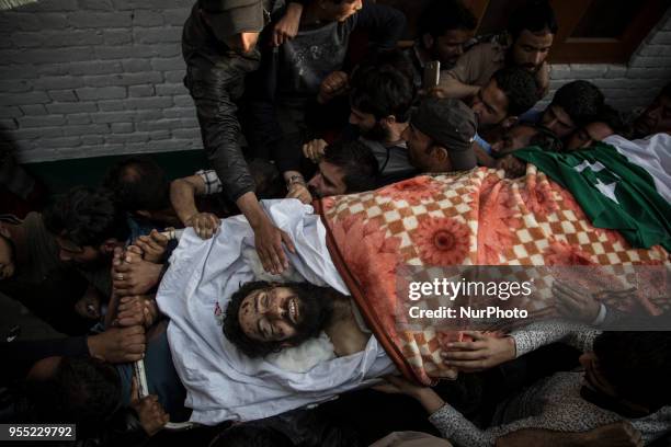 Kashmiri Muslims carry the body of Fayaz Ahmad Hamal, a local rebel, during his funeral procession Saturday, May 5 in Srinagar, Indian-controlled...