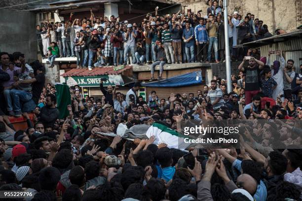 Kashmiri Muslims carry the body of Fayaz Ahmad Hamal, a local rebel, during his funeral procession Saturday, May 5, 2018 in Srinagar,...