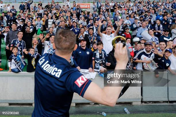 Besart Berisha goes to throw his medal to crowd during a fan gathering at AAMI Park on May 6, 2018 in Melbourne, Australia. Melbourne Victory...