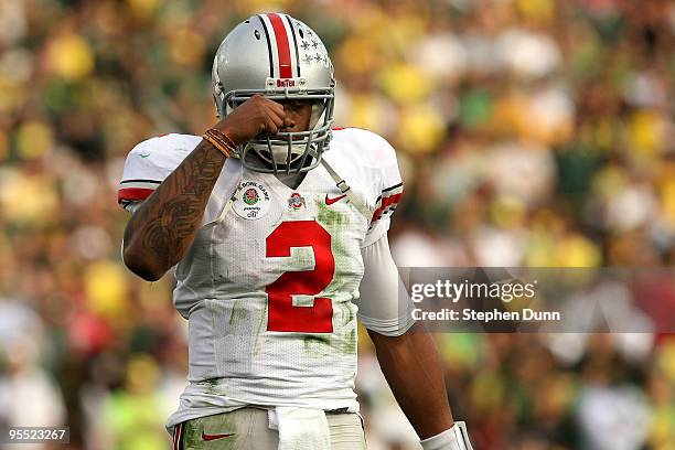 Quarterback Terrelle Pryor of the Ohio State Buckeyes walks on the field during the game against the Oregon Ducks at the 96th Rose Bowl game on...