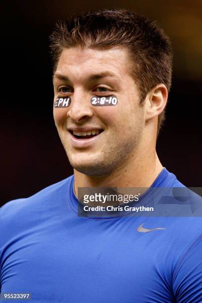 Quarterback Tim Tebow of the Florida Gators stands on the field before the Allstate Sugar Bowl against the Cincinnati Bearcats at the Louisana...