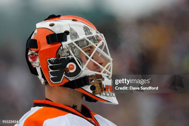 Michael Leighton of the Philadelphia Flyers looks on against the Boston Bruins during the 2010 Bridgestone NHL Winter Classic at Fenway Park on...