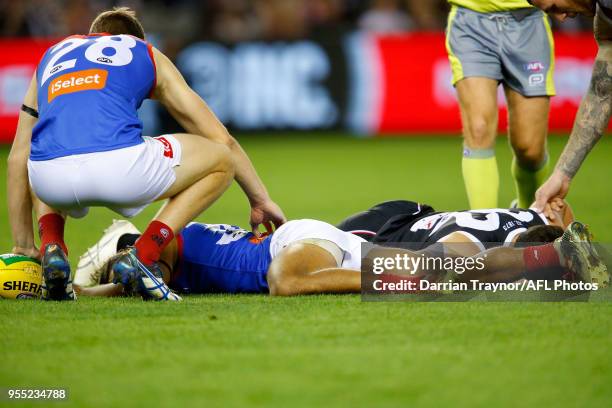 Paddy McCartin of the Saints and Neville Jetta of the Demons clash heads during the round seven AFL match between St Kilda Saints and the Melbourne...