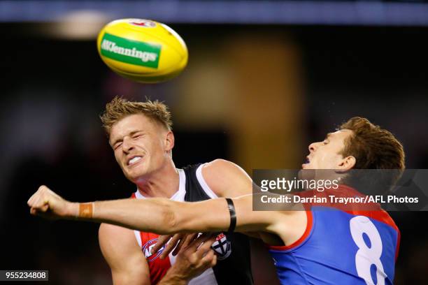 Jake Lever of the Demons spoils Jack Newnes of the Saints during the round seven AFL match between St Kilda Saints and the Melbourne Demons at Etihad...