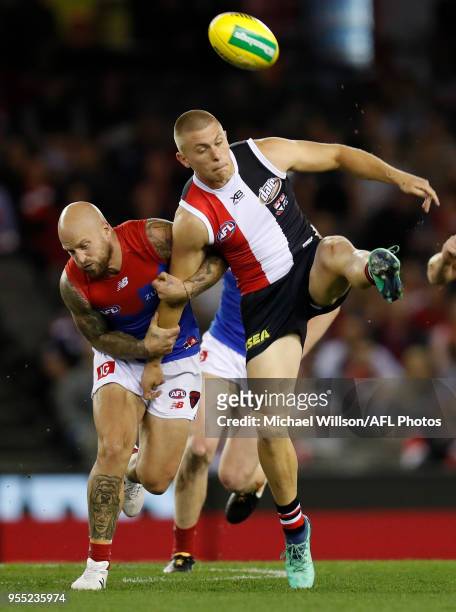 Sebastian Ross of the Saints is tackled by Nathan Jones of the Demons during the 2018 AFL round seven match between the St Kilda Saints and the...