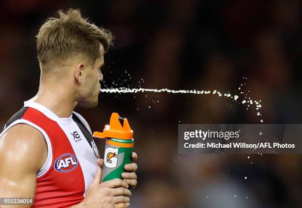 Maverick Weller of the Saints spits during the 2018 AFL round seven match between the St Kilda Saints and the Melbourne Demons at Etihad Stadium on...