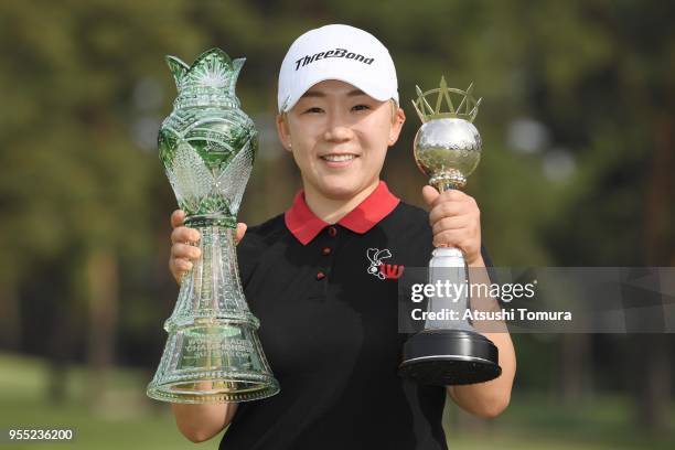 Jiyai Shin of South Korea poses with the trophy after winning the World Ladies Championship Salonpas Cup at Ibaraki Golf Course West Course on May 6,...