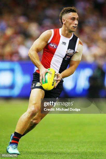 Luke Dunstan of the Saints looks upfield during the round seven AFL match between St Kilda Saints and the Melbourne Demons at Etihad Stadium on May...