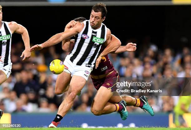 Jarryd Blair of Collingwood gets a kick away during the round seven AFL match between the Brisbane Lions and the Collingwood Magpies at The Gabba on...