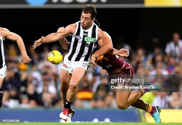 Jarryd Blair of Collingwood gets a kick away during the round seven AFL match between the Brisbane Lions and the Collingwood Magpies at The Gabba on...