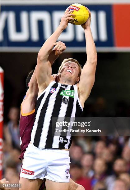 Jordan de Goey of Collingwood takes a mark during the round seven AFL match between the Brisbane Lions and the Collingwood Magpies at The Gabba on...