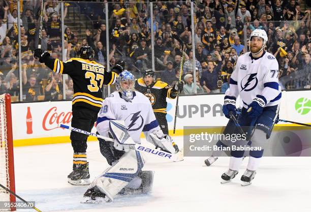 Patrice Bergeron and Brad Marchand of the Boston Bruins celebrate a goal against the Tampa Bay Lightning in Game Four of the Eastern Conference...
