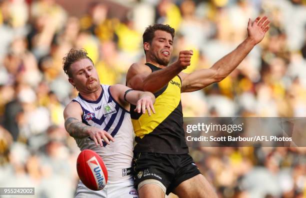 Cam McCarthy of the Dockers and Alex Rance of the Tigers compete for the ball during the round seven AFL match between the Richmond Tigers and the...