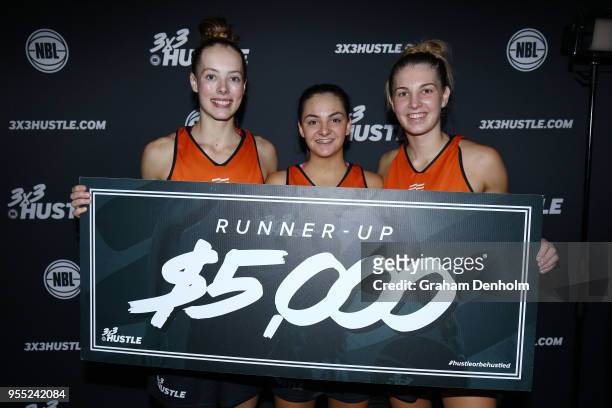Jasmine Simmons, Monique Conti and Jaz Shelley of Melbourne Boomers pose after their match against Spectres iAthletic in the final during the NBL 3x3...