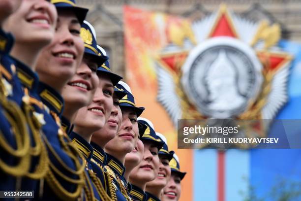 Russian millitary personnel march past on Red Square in Moscow on May 6, 2018 during a rehearsal for the Victory Day military parade. - Russia marks...