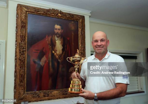 European Ryder Ciup Captain Thomas Bjorn stands beside a portrait of Ryder Cup founder Samuel Ryder at Verulam Golf Cub on May 5, 2018 in St Albans,...
