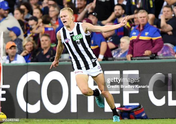 Jaidyn Stephenson of Collingwood celebrates kicking a goal during the round seven AFL match between the Brisbane Lions and the Collingwood Magpies at...