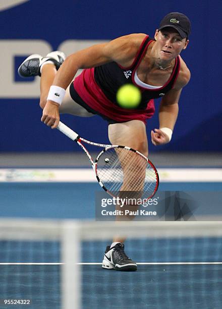 Samantha Stosur of Australia serves in her match against Sorena Cirstea of Romania in the Group A match between Australia and Romania during day one...