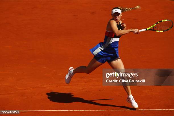 Caroline Wozniacki of Denmark plays a forehand against Daria Gavrilova of Australia during day two of the Mutua Madrid Open tennis tournament at the...