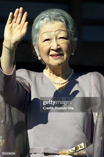 Empress Michiko waves to the well-wishers celebrating the New Year at the Imperial Palace on January 2, 2010 in Tokyo, Japan.