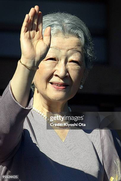 Empress Michiko waves to the well-wishers celebrating the New Year at the Imperial Palace on January 2, 2010 in Tokyo, Japan.