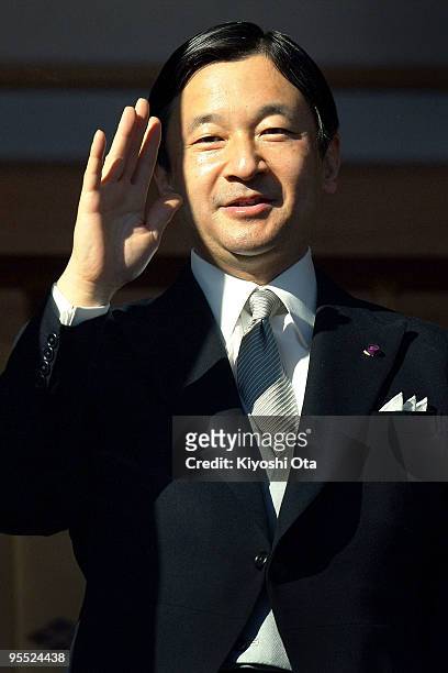 Crown Prince Naruhito waves to the well-wishers celebrating the New Year at the Imperial Palace on January 2, 2010 in Tokyo, Japan.
