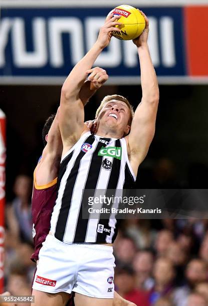 Jordan de Goey of Collingwood takes a mark during the round seven AFL match between the Brisbane Lions and the Collingwood Magpies at The Gabba on...