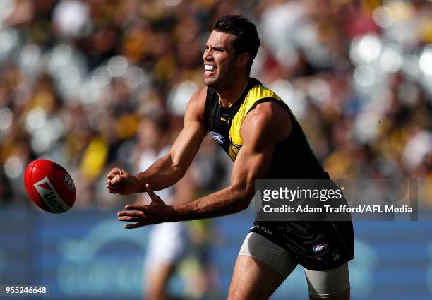 Alex Rance of the Tigers handpasses the ball during the 2018 AFL round seven match between the Richmond Tigers and the Fremantle Dockers at the...