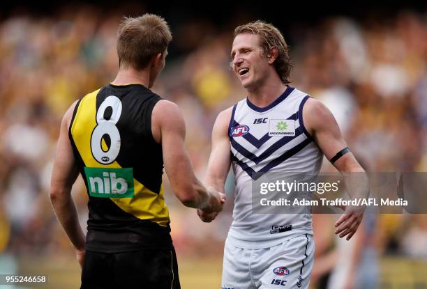 Jack Riewoldt of the Tigers shakes hands with David Mundy of the Dockers during the 2018 AFL round seven match between the Richmond Tigers and the...