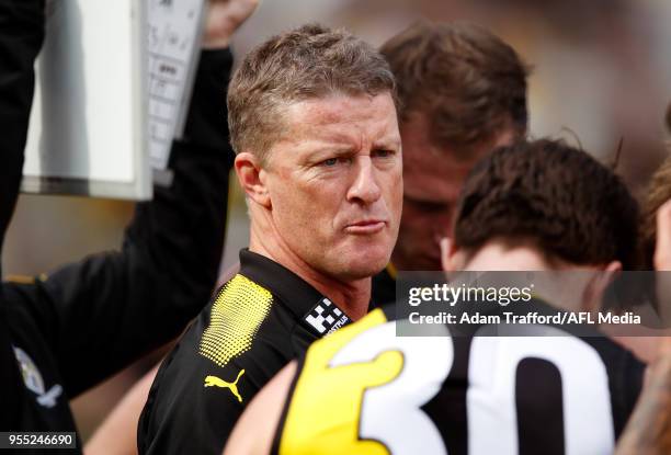 Damien Hardwick, Senior Coach of the Tigers addresses his players during the 2018 AFL round seven match between the Richmond Tigers and the Fremantle...