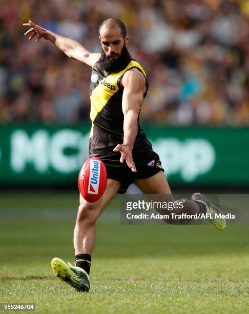 Bachar Houli of the Tigers kicks a goal in his 150th game during the 2018 AFL round seven match between the Richmond Tigers and the Fremantle Dockers...