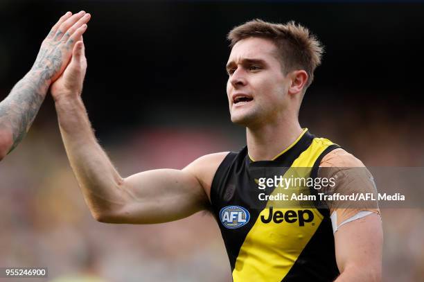 Jayden Short of the Tigers celebrates with Dustin Martin of the Tigers during the 2018 AFL round seven match between the Richmond Tigers and the...