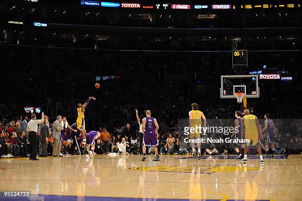 Kobe Bryant of the Los Angeles Lakers shoots a last-second shot to defeat the Sacramento Kings 109-108 at Staples Center on January 1, 2010 in Los...