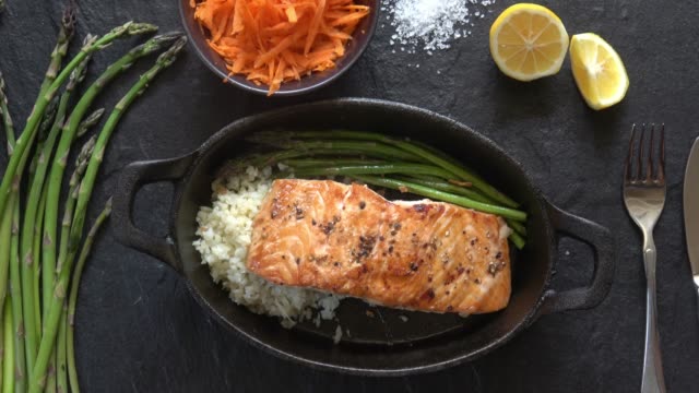 Grilled Salmon Fillet with Asparagus and Cauliflower Rice.