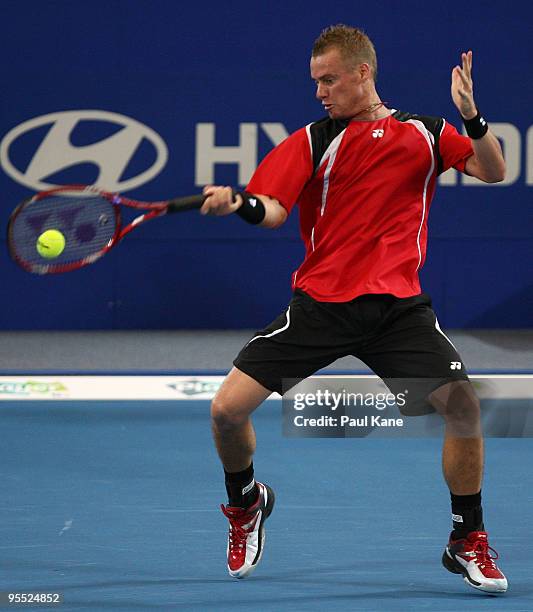 Lleyton Hewitt of Australia plays a forehand in his match against Victor Hanescu of Romania in the Group A match between Australia and Romania during...