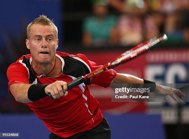 Lleyton Hewitt of Australia plays a forehand in his match against Victor Hanescu of Romania in the Group A match between Australia and Romania during...