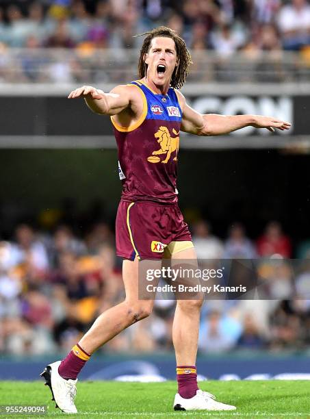 Matt Eagles of the Lions calls out to his team mates during the round seven AFL match between the Brisbane Lions and the Collingwood Magpies at The...