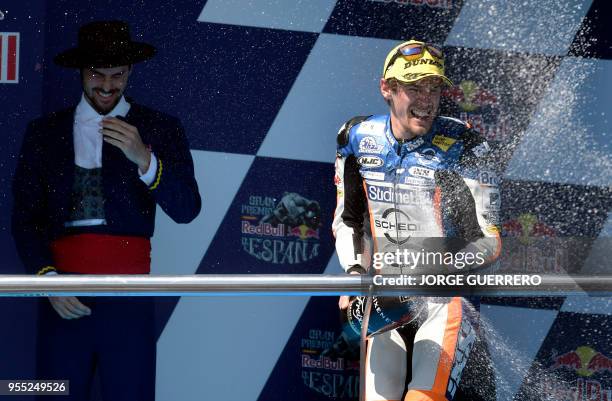 First placed Schedl GP Racing's German rider Philipp Oettl celebrates on the podium after the Moto3 race of the Spanish Grand Prix at the Jerez Angel...