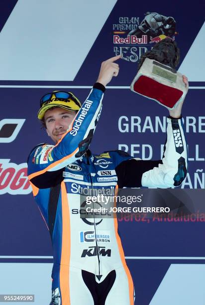 First placed Schedl GP Racing's German rider Philipp Oettl celebrates on the podium after the Moto3 race of the Spanish Grand Prix at the Jerez Angel...