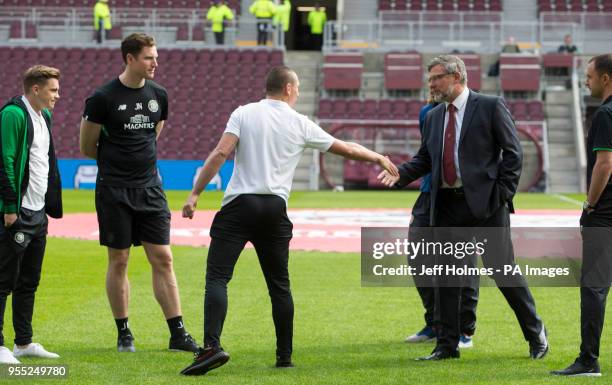 Celtics Scott Brown shakes hands with Hearts manager Craig Levein during the Ladbrokes Scottish Premiership match at Tynecastle Stadium, Edinburgh.