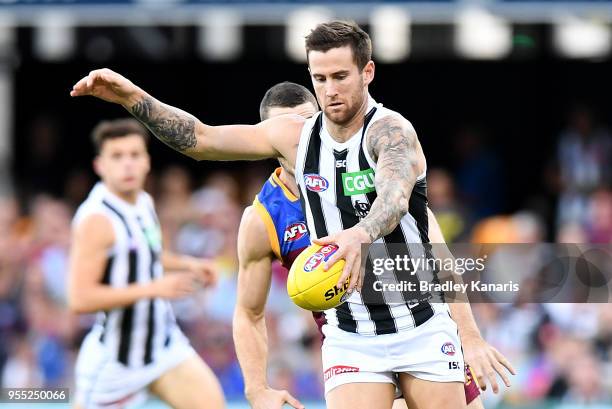 Jeremy Howe of Collingwood kicks the ball during the round seven AFL match between the Brisbane Lions and the Collingwood Magpies at The Gabba on May...