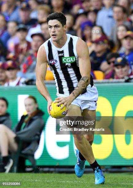 Jack Crisp of Collingwood in action during the round seven AFL match between the Brisbane Lions and the Collingwood Magpies at The Gabba on May 6,...