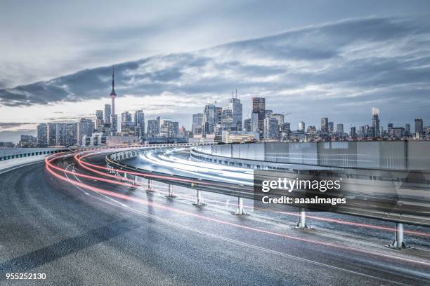 busy dusk traffic of toronto city - toronto cityscape stock pictures, royalty-free photos & images