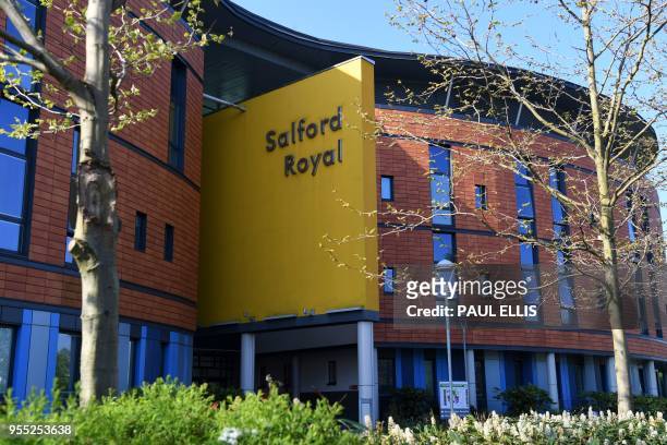 The exterior of the Salford Royal Hospital is pictured in Salford, Greater Manchester on May 6, 2018. - Messages of support continued to pour in as...