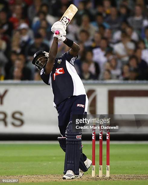 Dwayne Bravo of the Bushrangers hits a towering six down the ground during the Twenty20 Big Bash match between the Victorian Bushrangers and the New...