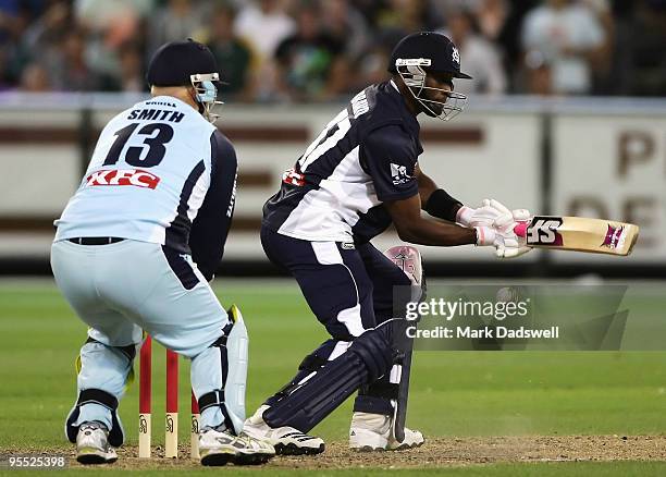 Dwayne Bravo of the Bushrangers square cuts during the Twenty20 Big Bash match between the Victorian Bushrangers and the New South Wales Blues at...