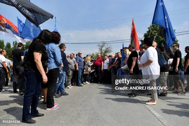 Serbian Radical Party leader Vojislav Seselj , stands surrounded by journalists and party members, as strong police presence stopped him in the...