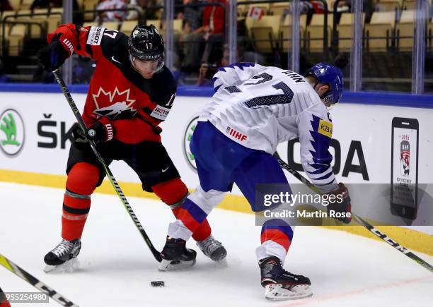 Jin Hui Ahn of Korea and Jaden Schwartz of Canada battle for the puck during the 2018 IIHF Ice Hockey World Championship group stage game between...