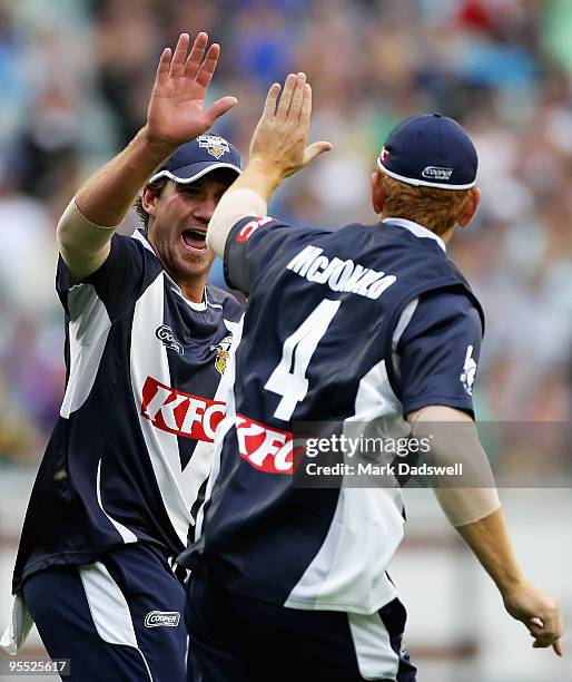 John Hastings of the Bushrangers congratulates Andrew McDonald for catching Dominic Thornley of the Blues during the Twenty20 Big Bash match between...