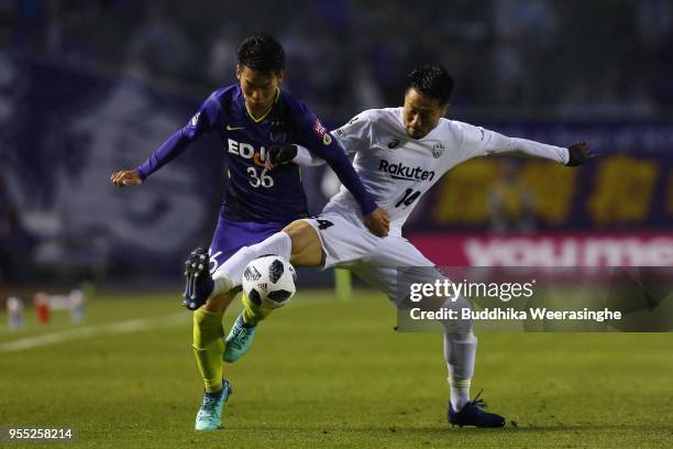 Hayao Kawabe of Sanfrecce Hiroshima and Naoyuki Fujita of Vissel Kobe compete for the ball during the J.League J1 match between Sanfrecce Hiroshima...